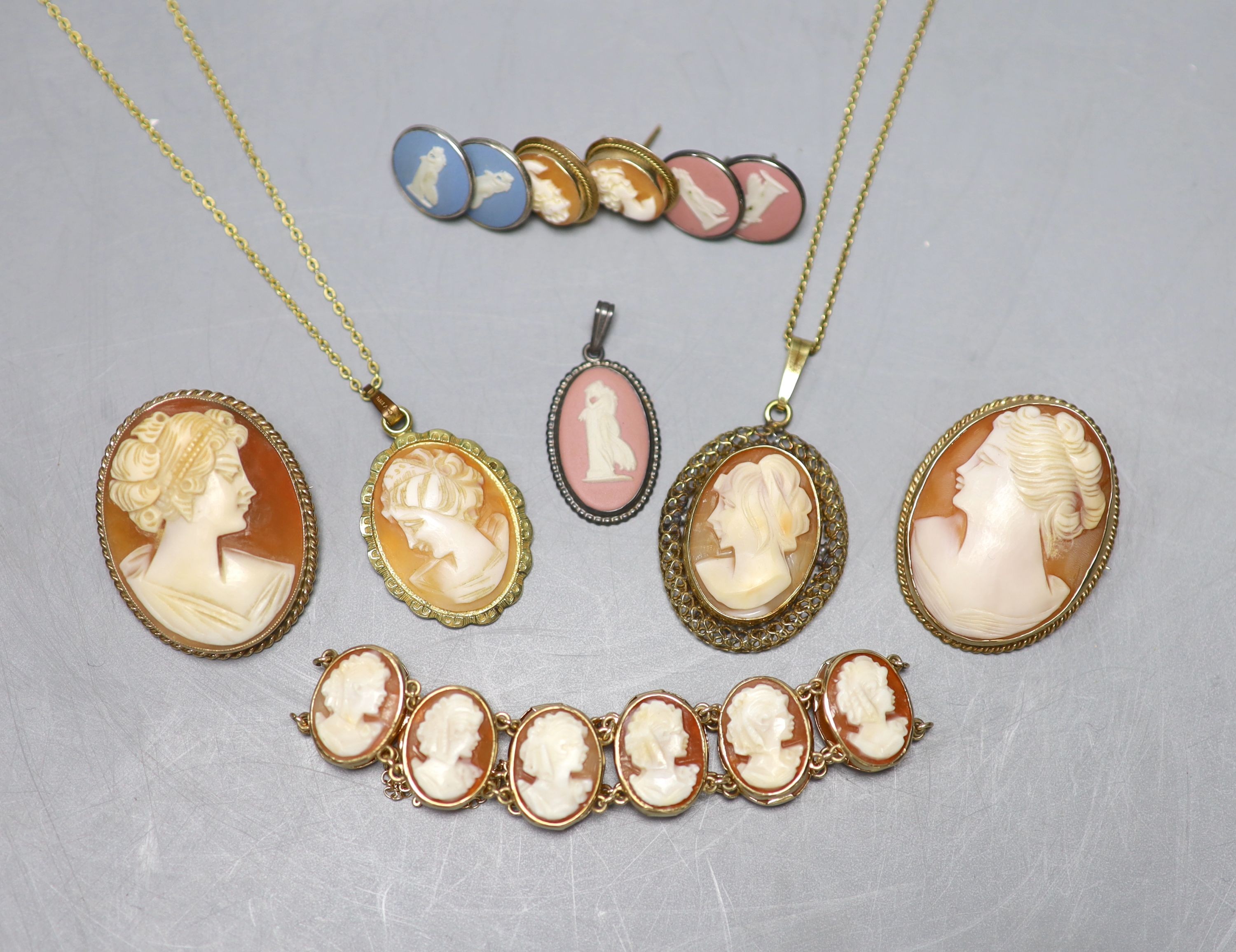 A modern 9ct gold and oval cameo shell bracelet, 16cm, two 9ct mounted cameo shell brooches, a pair of 9ct gold and cameo shell earrings and seven other items, 9ct gross 31.4 grams.
